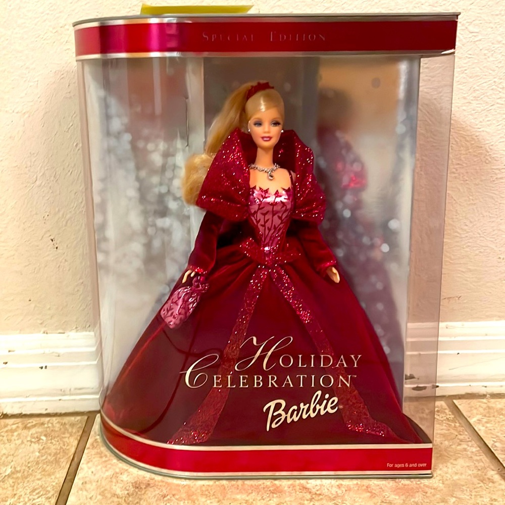 This is a Holiday celebration Barbie 2002 hallmark keepsake in box never opened